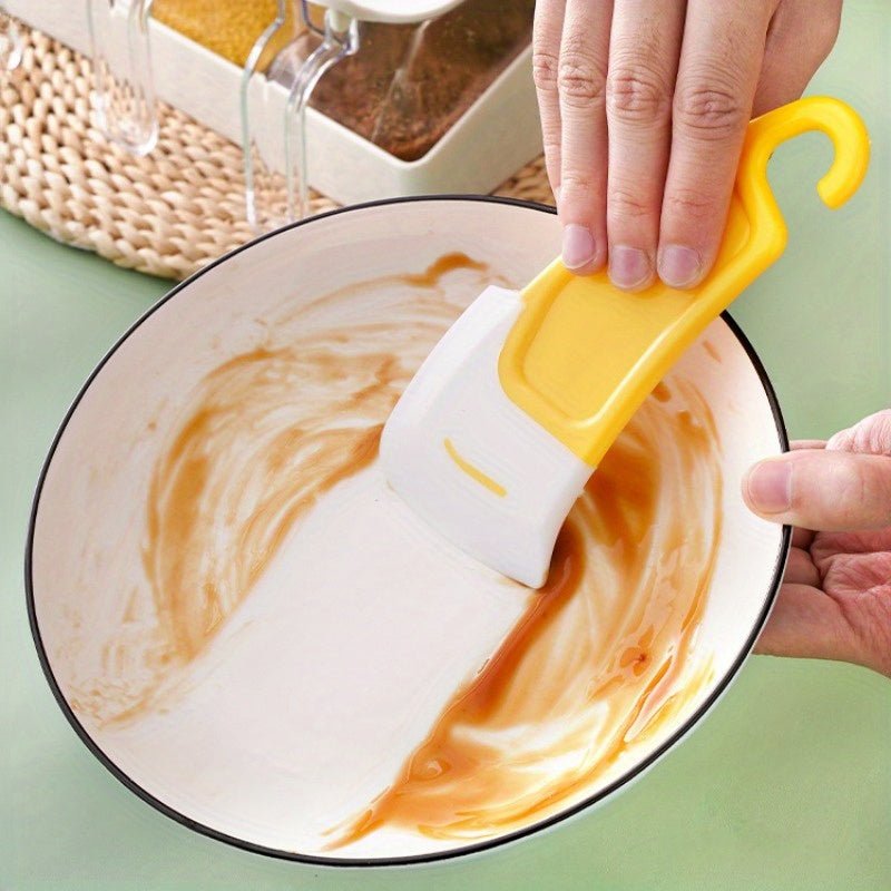 1701696597102-34c7e5ac8c3b408e95b9c3080f8cda15-goods.jpg Silicone Kitchen Scraper - Image 1